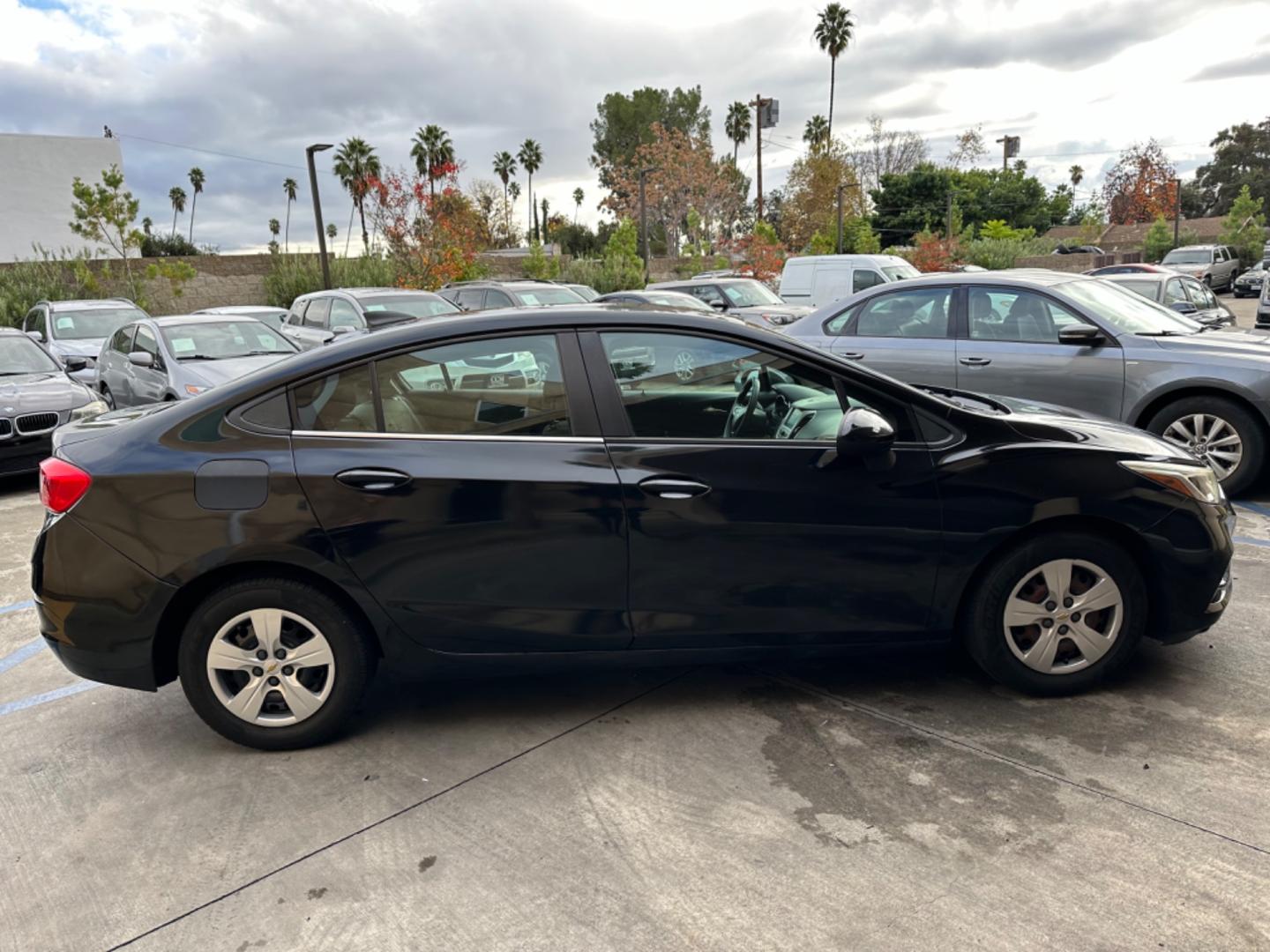 2017 Black /BLACK Chevrolet Cruze LS Auto (1G1BC5SM6H7) with an 1.4L L4 DOHC 16V TURBO engine, 6A transmission, located at 30 S. Berkeley Avenue, Pasadena, CA, 91107, (626) 248-7567, 34.145447, -118.109398 - Crown City Motors is a used “Buy Here Pay Here” car dealer in Pasadena CA. “Buy Here Pay Here” financing, means that when you purchase your vehicle from our dealership, that you make the payments to the dealership as well. We do not need the banks approval to get you approved for a used auto - Photo#5